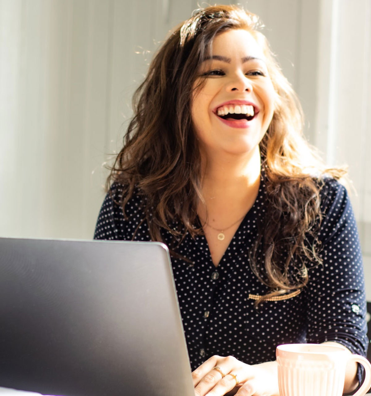 Smiling Woman on laptop
